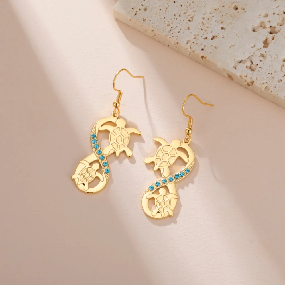 Boucles d’oreilles tortue et symbole infini